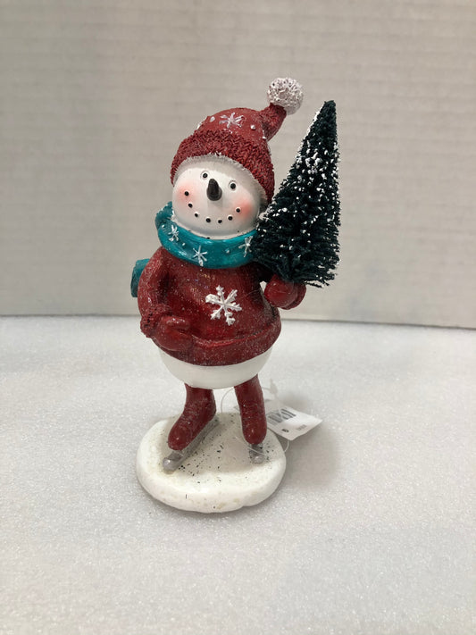 Snowman holding tree