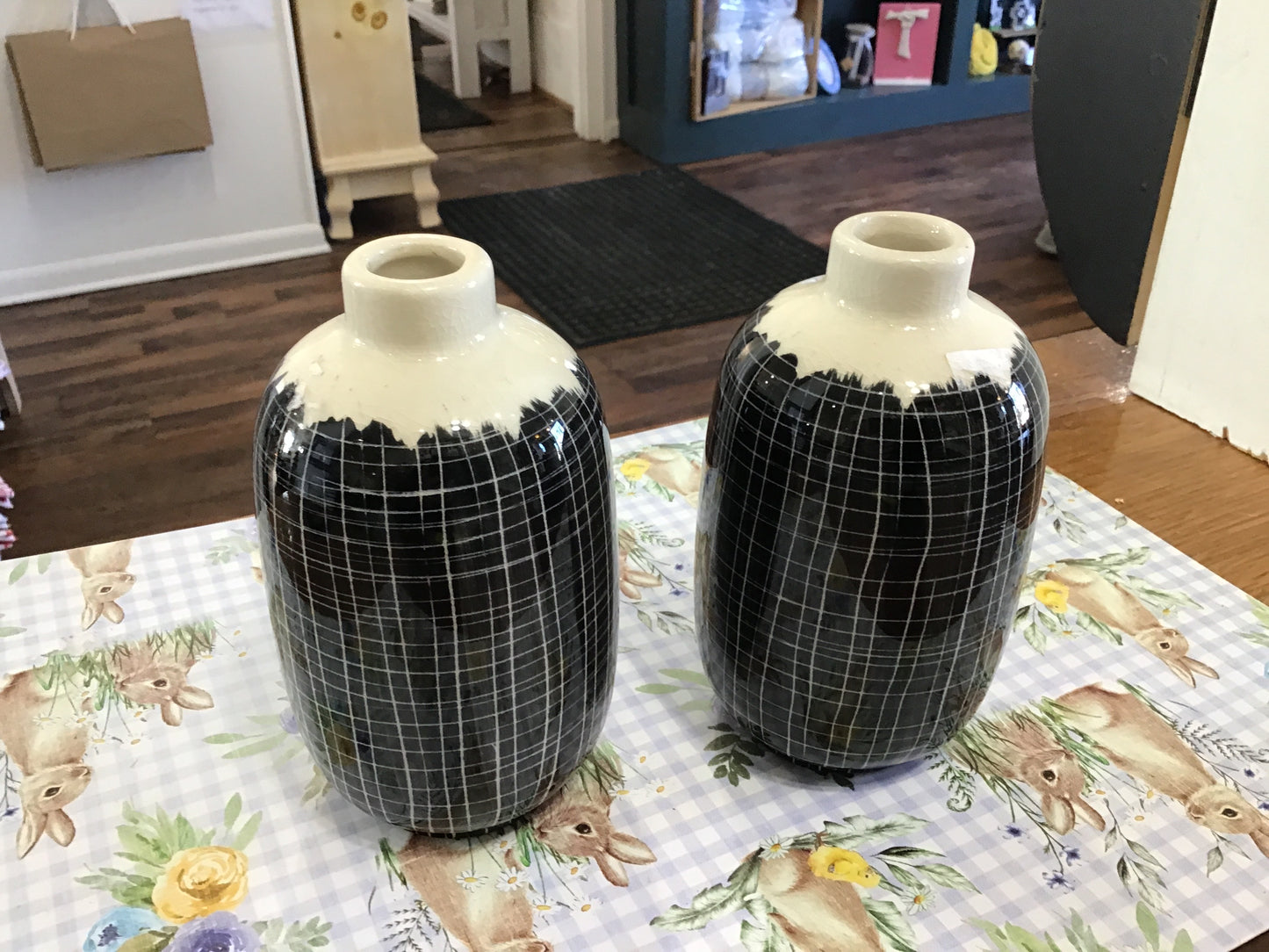 Tall black and white bud vase
