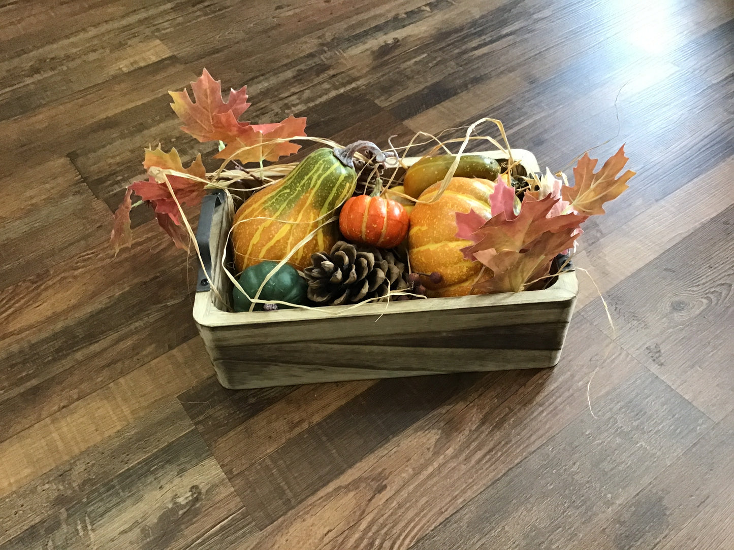 Square wood bowl with decorative pumpkins etc… 14 inches long 5 inches tall