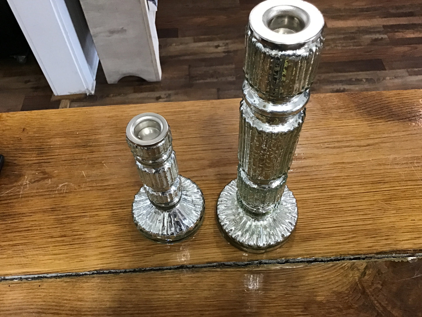 Set of two mercury glass silver candle sticks large 10 inches tall small 6 inches tall