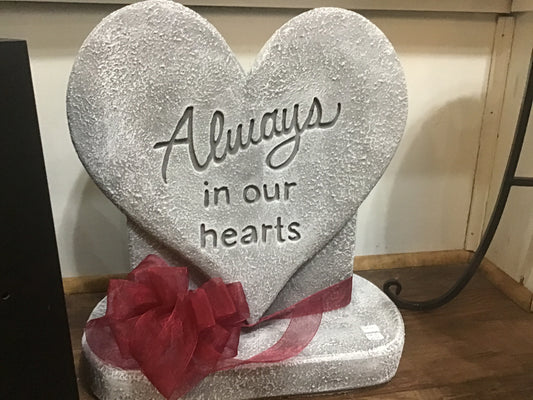 Cement heart Always in our hearts on a base