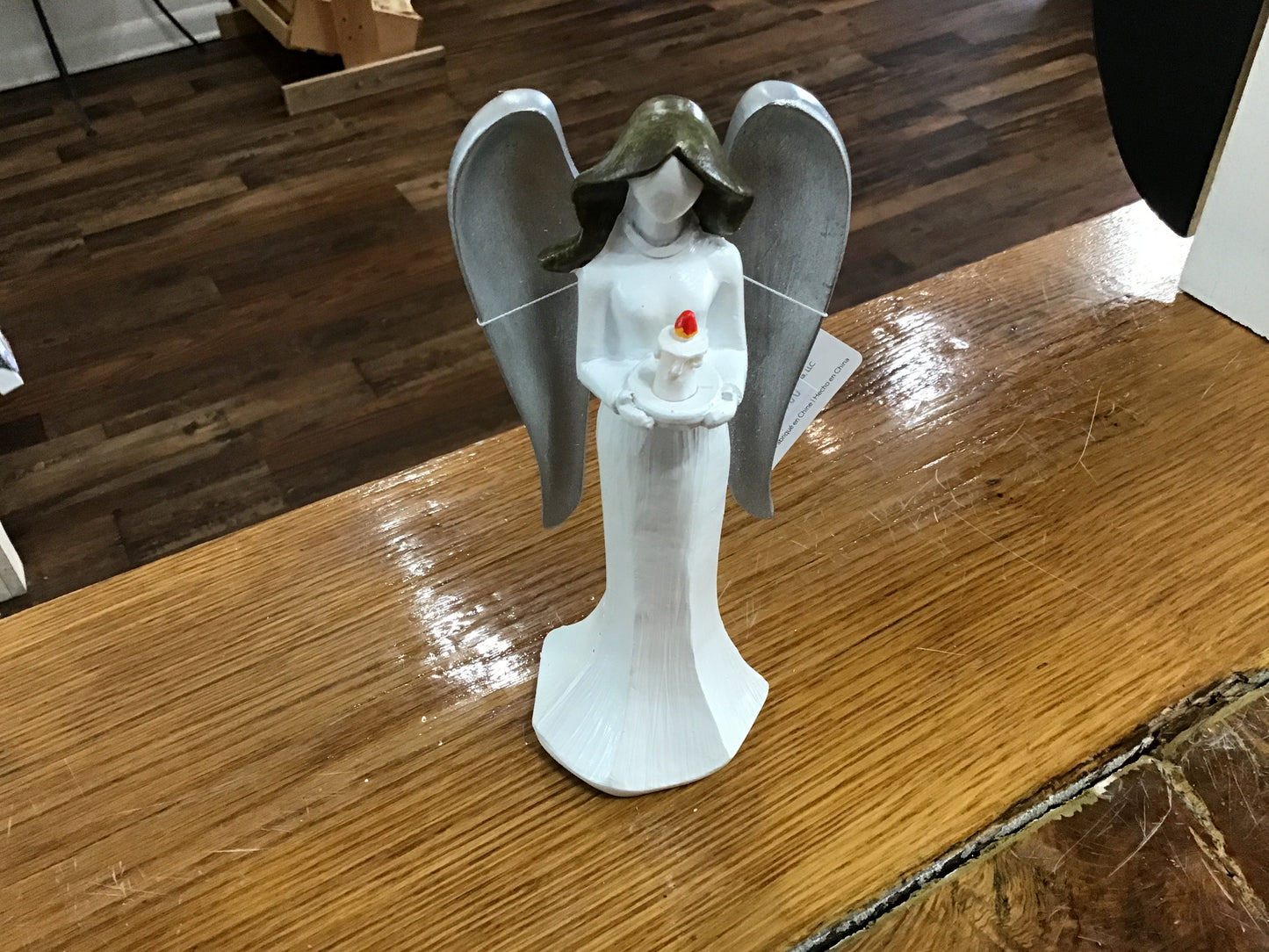 Christmas angel holding candle lights up shelf sitter