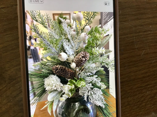 Winter arrangement with green pottery
