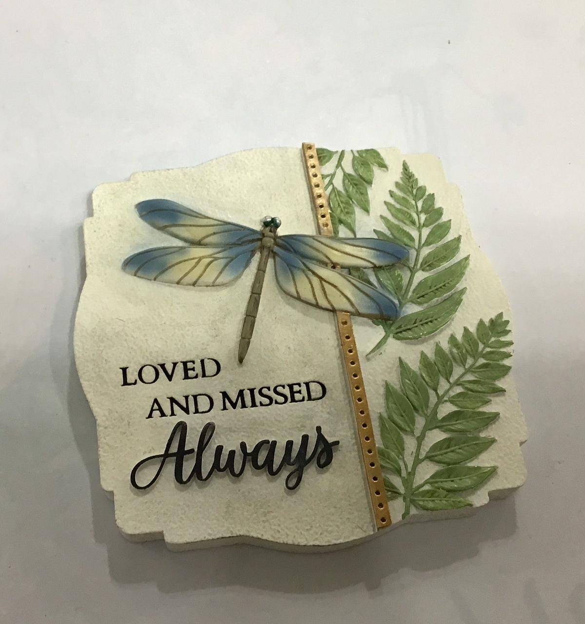 Small garden stone memorial dragonfly