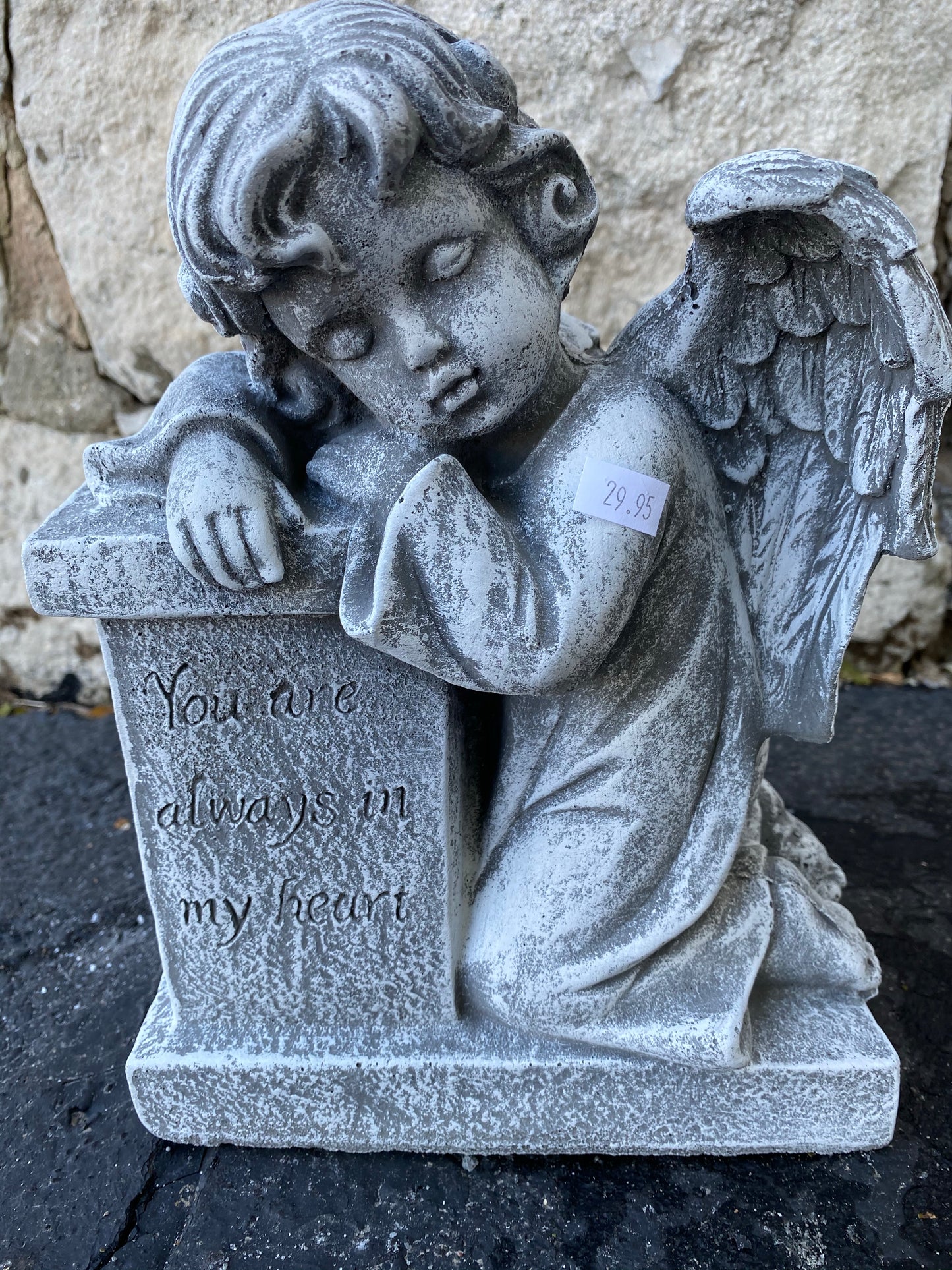 Angel leaning on column